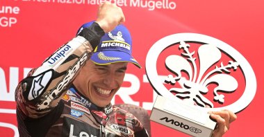Ducati rider Marc Marquez celebrates with the trophy after winning the Italian Moto GP Grand Prix at Mugello circuit, in Mugello, near Florence, Italy, June 22, 2025. (AFP Photo)