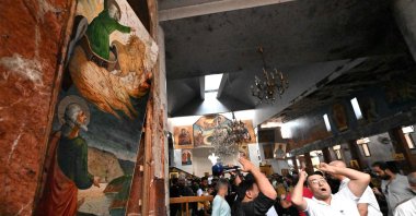 People and rescuers inspect the damage at the site of a reported suicide attack at the Saint Elias church in Damascus' Dwelaa area, Syria, June 22, 2025. (AFP Photo)