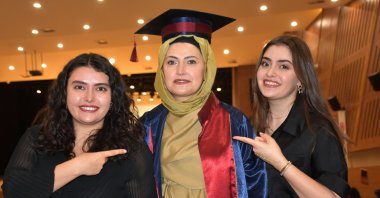 Gülsüm Taş (C) celebrates her graduation with her daughters Elif Nur (L) and Ebrar Taş, Sivas, Türkiye, June 23, 2025. (DHA Photo)