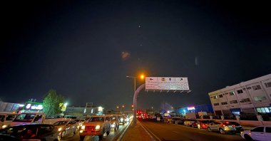 Traces are seen in the sky after Iran&#039;s armed forces say they targeted Al-Udeid air base in a missile attack, Doha, Qatar, June 23, 2025. (Reuters Photo)