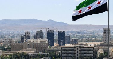 A large Syrian flag flutters above Tishreen Park, Damascus, Syria, June 4, 2025. (AFP Photo)