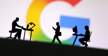 Miniature figures of people are seen in front of the new Google logo, May 13, 2025. (Reuters Photo)