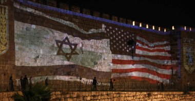 A projection depicting Israeli and U.S. flags on the walls of the Old City, East Jerusalem, Israeli-occupied Palestine, June 22, 2025. (AFP Photo)