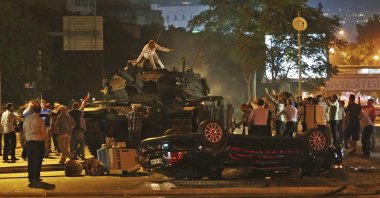 People try to stop tanks controlled by FETÖ infiltrators in the army during the coup attempt, Ankara, Türkiye, July 16, 2016. (AP Photo)