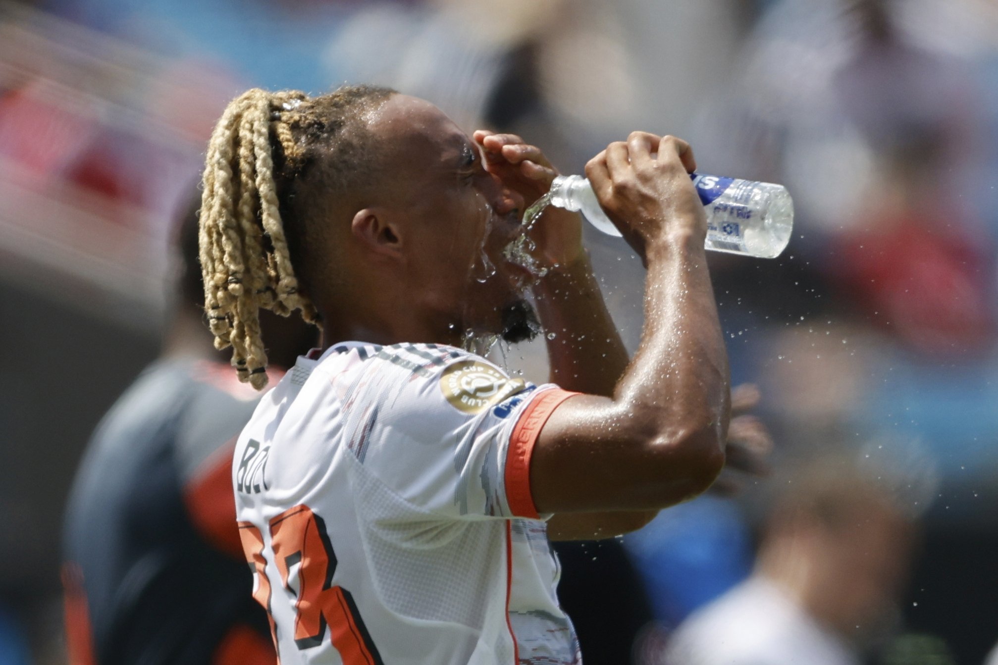Bayern Munich's Sacha Boey pours water on his face during the Club World Cup Group C match against Benfica, Charlotte, U.K., June 24, 2025. (AP Photo)