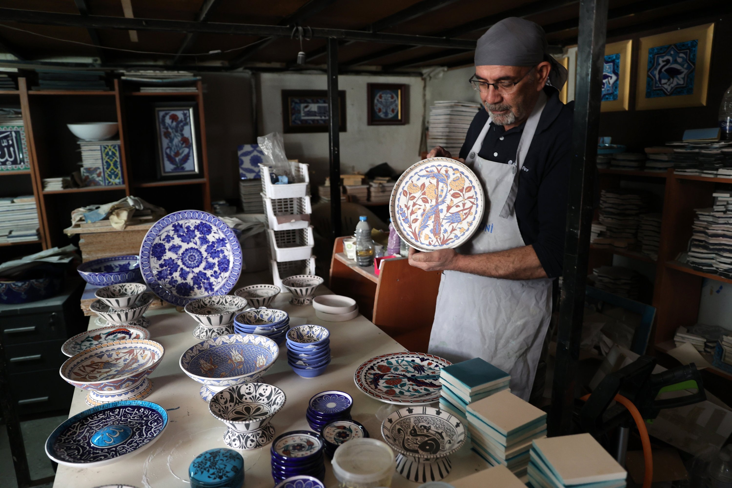 Kemal Güler, a 61-year-old archaeologist specializing in tile art, showcases his works, Konya, Türkiye, June 3, 2025. (AA Photo)
