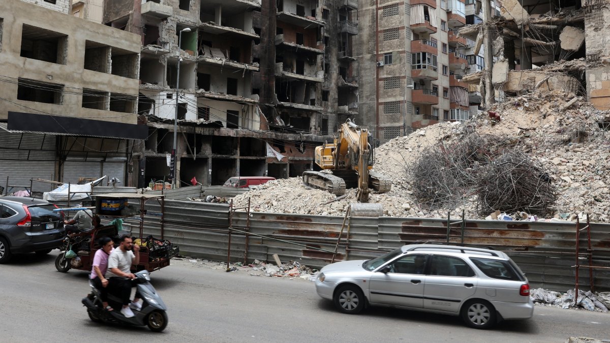Cars and motorbikes drive near damaged buildings in Beirut southern suburbs, Lebanon, June 23, 2025. (Reuters Photo)