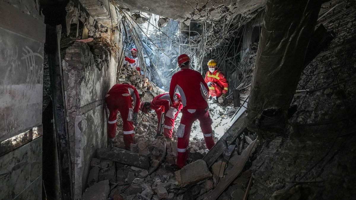 Rescuers sift through the rubble inside in the Evin prison complex that was hit by an Israeli strike, in Tehran, Iran, June 25, 2025. (AFP Photo)