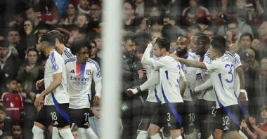 Lyon's Nicolas Tagliafico (C) celebrates with teammates after scoring his side's second goal during the Europa League quarterfinal second leg match between Manchester United and Olympique Lyon, Manchester, U.K., April 17, 2025. (AP Photo)