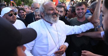 Demonstrators surround protest leader Archbishop Bagrat Galstanyan during a march against land transfer to Azerbaijan, in Yerevan, Armenia, May 9, 2024. (AFP Photo)