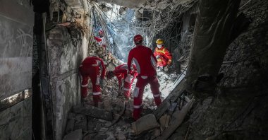 Rescuers sift through the rubble inside in the Evin prison complex that was hit by an Israeli strike, in Tehran, Iran, June 25, 2025. (AFP Photo)