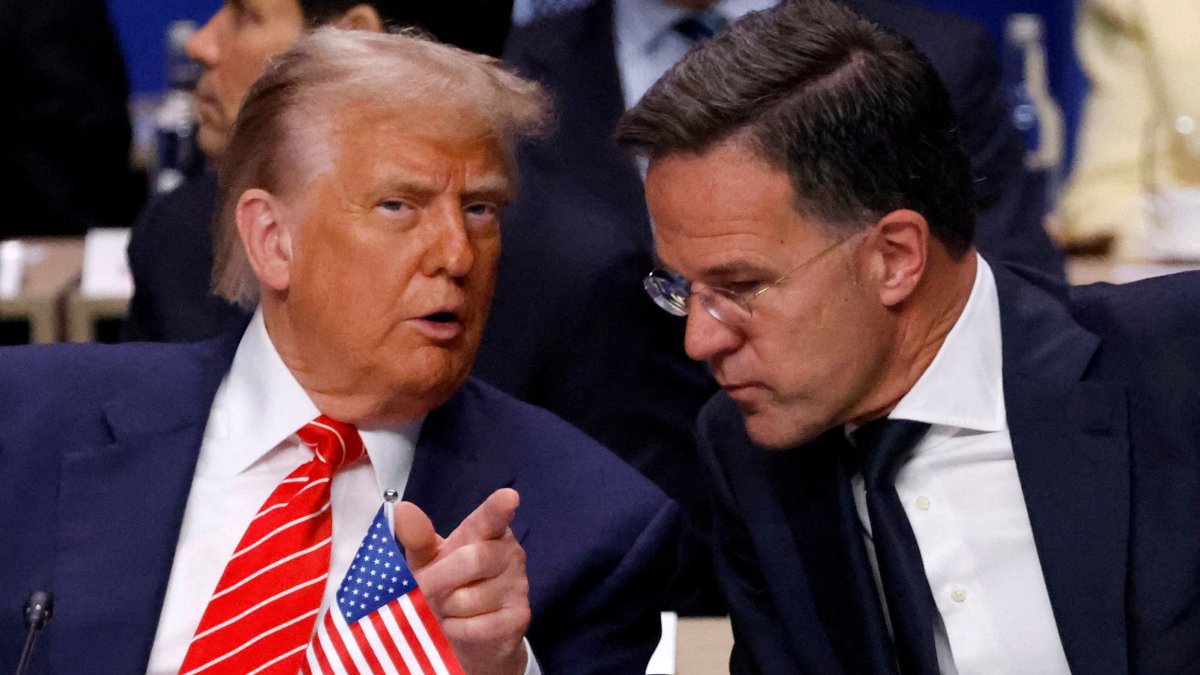 U.S. President Donald Trump speaks with NATO Secretary-General Mark Rutte in The Hague, the Netherlands, June 25, 2025. (Reuters Photo)
