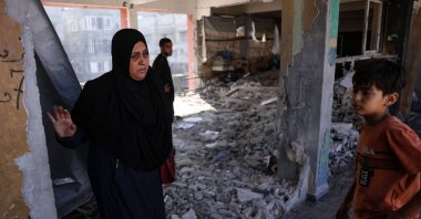 Displaced Palestinians check the destruction in a classroom used as a temporary shelter, inside a school hit by an Israeli strike, Gaza, Palestine, June 26, 2025. (AFP Photo)