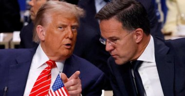 U.S. President Donald Trump speaks with NATO Secretary-General Mark Rutte in The Hague, the Netherlands, June 25, 2025. (Reuters Photo)