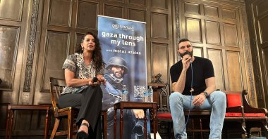 Palestinian photographer and Instagram star Motaz Azaiza (R) speaks during a discussion with scholar Noura Erakat (L) during an event at the First Unitarian Church of Philadelphia to collect donations for the UNRWA, Philadelphia, Pennsylvania, U.S., June 23, 2025. (AFP Photo)