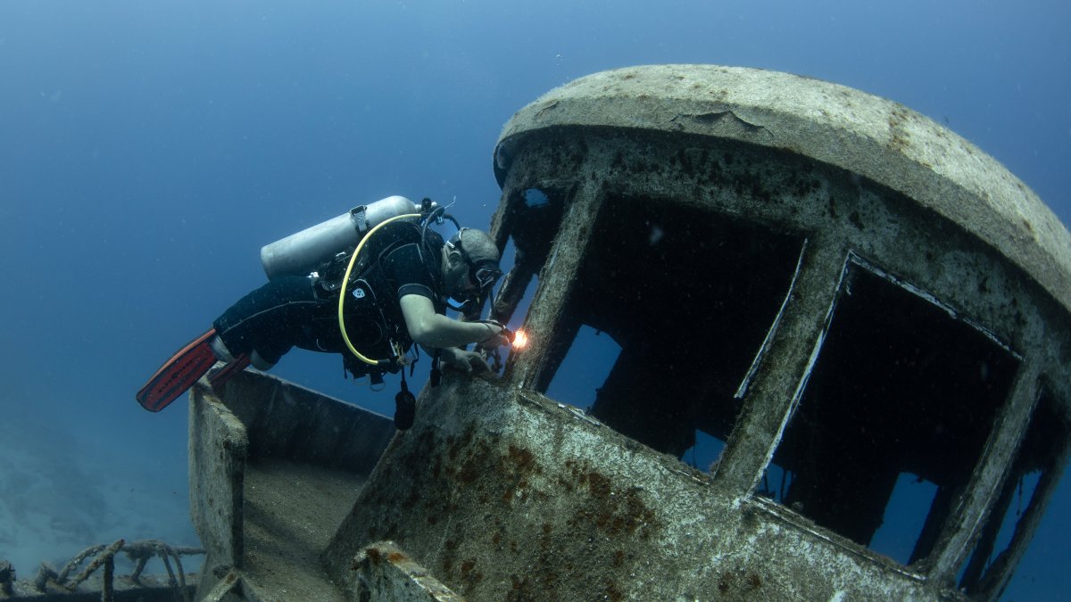 World-record-holding freediver Ufuk Koçak explores a sunken ship during a dive off the coast of Kaş, Antalya, Türkiye, June 21, 2025. (AA Photo)