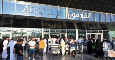 Evacuees who fled by land to Turkmenistan from Iran following Israeli strikes arrive at Kuwait International Airport, Kuwait, June 21, 2025. (AFP Photo)