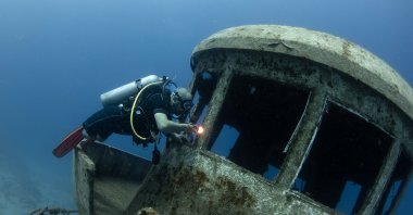 World-record-holding freediver Ufuk Koçak explores a sunken ship during a dive off the coast of Kaş, Antalya, Türkiye, June 21, 2025. (AA Photo)