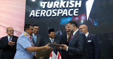 Indonesian President Prabowo Subianto (C), head of Türkiye&#039;s Defense Industries Secretariat Haluk Görgün (3rd R), Indonesian Defense Minister Sjafrie Sjamsoeddin (3rd L), TAI Board Chair Ömer Cihad Vardan (R), Deputy Defense Minister Şuay Alpay (L) and TAI CEO Mehmet Demiroğlu (2nd R) at the signing ceremony of the deal to sell 48 KAAN fighter jets to Indonesia, Jakarta, Indonesia, June 11, 2025. (AA Photo)