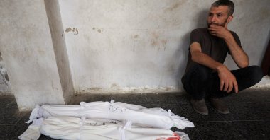 A mourner reacts near the bodies of Palestinian children killed in an Israeli strike in Gaza City, Palestine, June 29, 2025. (Reuters Photo)