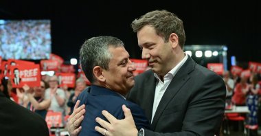 Chair of Germany's Social Democratic Party (SPD) and Vice-Chancellor Lars Klingbeil (R) hugs CHP leader Özgür Özel during an event, Berlin, Germany, June 28, 2025. (AFP Photo)