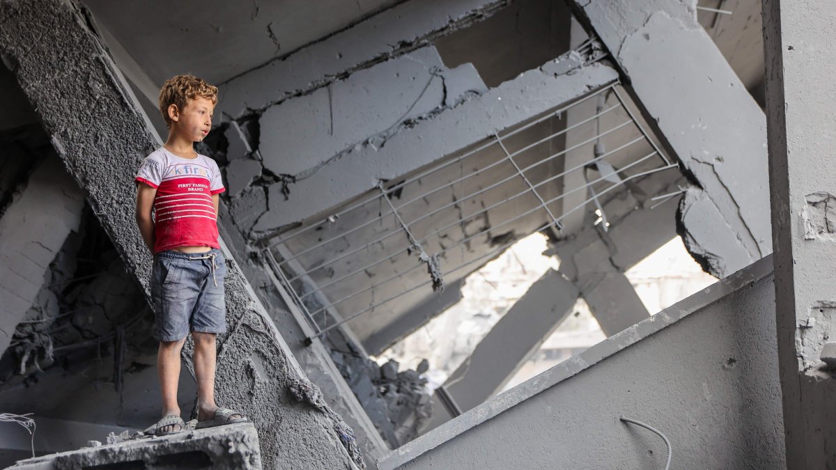 A Palestinian boy stands amidst the rubble of Yaffa School in the Tuffah neighbourhood following overnight Israeli strikes, Gaza City, central Gaza, Palestine, June 30, 2025. (AFP Photo)