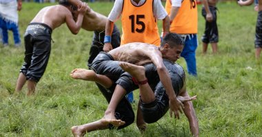 Wrestlers compete during the 663rd edition of the annual Historic Kırkpınar Oil Wrestling championship, Edirne, Türkiye, July 7, 2024. (AFP Photo)