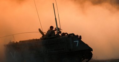 An Israeli military vehicle manoeuvres near the Israel-Gaza border, as seen from Israel, June 29, 2025. (Reuters Photo)