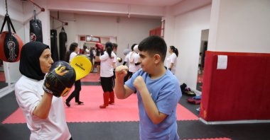 Mekiye Zümrüt, who donated her kidney to her son, trains students at the sports gym after winning second place at the Türkiye Open WAKO World Cup, Diyarbakır, Türkiye, June 30, 2025. (AA Photo) 