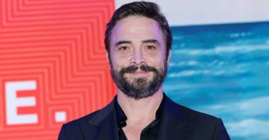 Renowned actor Ahmet Kural holds his award and poses at the Italian Global Series Festival, the Riccione and Rimini regions of Italy, June 28, 2025. (AA Photo)