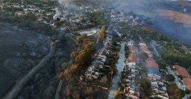 An aerial view of a residential area damaged by a wildfire in Seferihisar, Izmir, western Türkiye, July 1, 2025. (AA Photo)