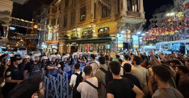 Protesters gather near Leman&#039;s offices as riot police take security measures, Istanbul, Türkiye, June 30, 2025. (AA Photo)