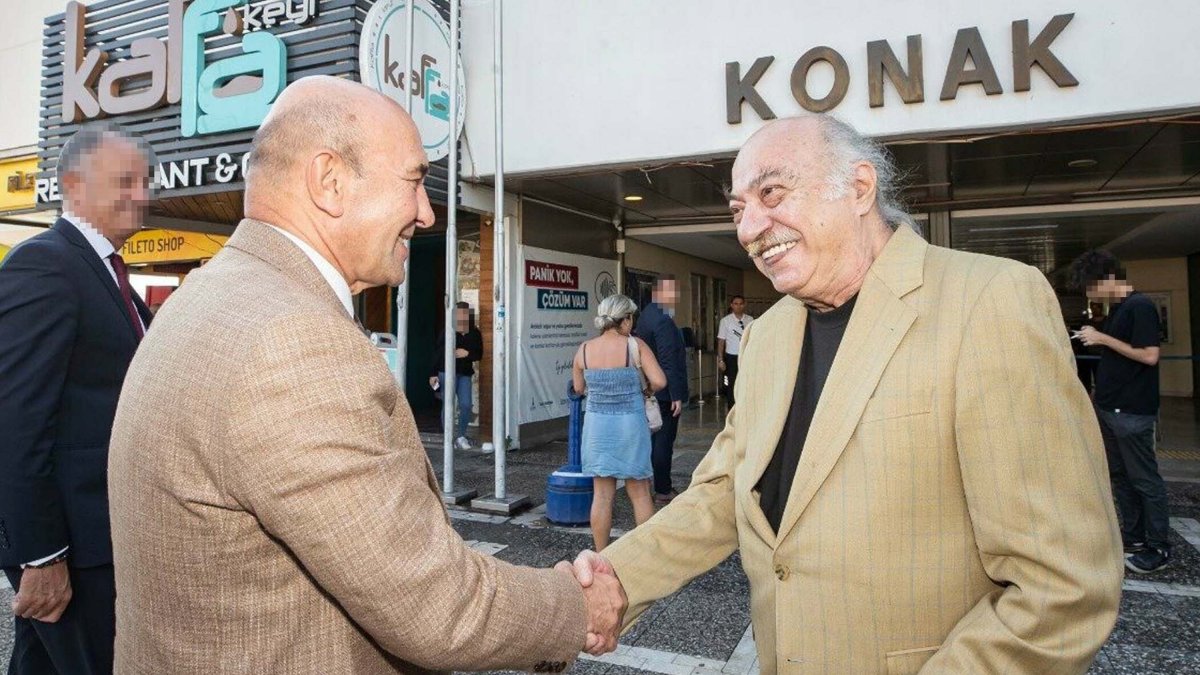 This undated photo shows former Mayor Tunç Soyer shaking hands with actor Yücel Erten, who was also detained in Tuesday's operations, Türkiye. (DHA Photo)