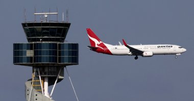 A Qantas Airways Boeing 737-800 passenger aircraft comes in on a final approach for landing at Sydney’s Kingsford Smith International Airport, Sydney, Australia, Dec. 6, 2023. (AFP Photo)