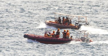 Rescuers conduct search operations following the sinking of a ferry near Gilimanuk Port, Bali, Indonesia, July 3, 2025. (EPA Photo)
