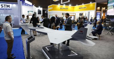 Visitors stand near miniatures of Turkish combat aircraft Kaan during the Indo Defense 2025 exhibition, Jakarta, Indonesia, June 12, 2025. (EPA Photo)