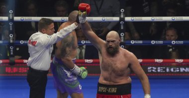 Britain&#039;s Tyson Fury reacts at the end of his WBA, WBO, and WBC world heavyweight title fight against Ukraine&#039;s Oleksandr Usyk in Riyadh, Saudi Arabia, U.K., Dec. 22, 2024. (AP Photo)