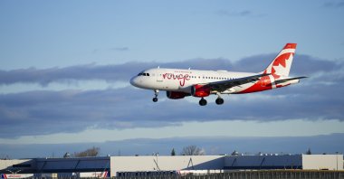 An Air Canada Rouge plane lands at Montreal-Pierre Elliott Trudeau International Airport in Montreal, Que., Wednesday, April 23, 2025. (Credit Image: © Sean Kilpatrick/The Canadian Press via ZUMA Press)