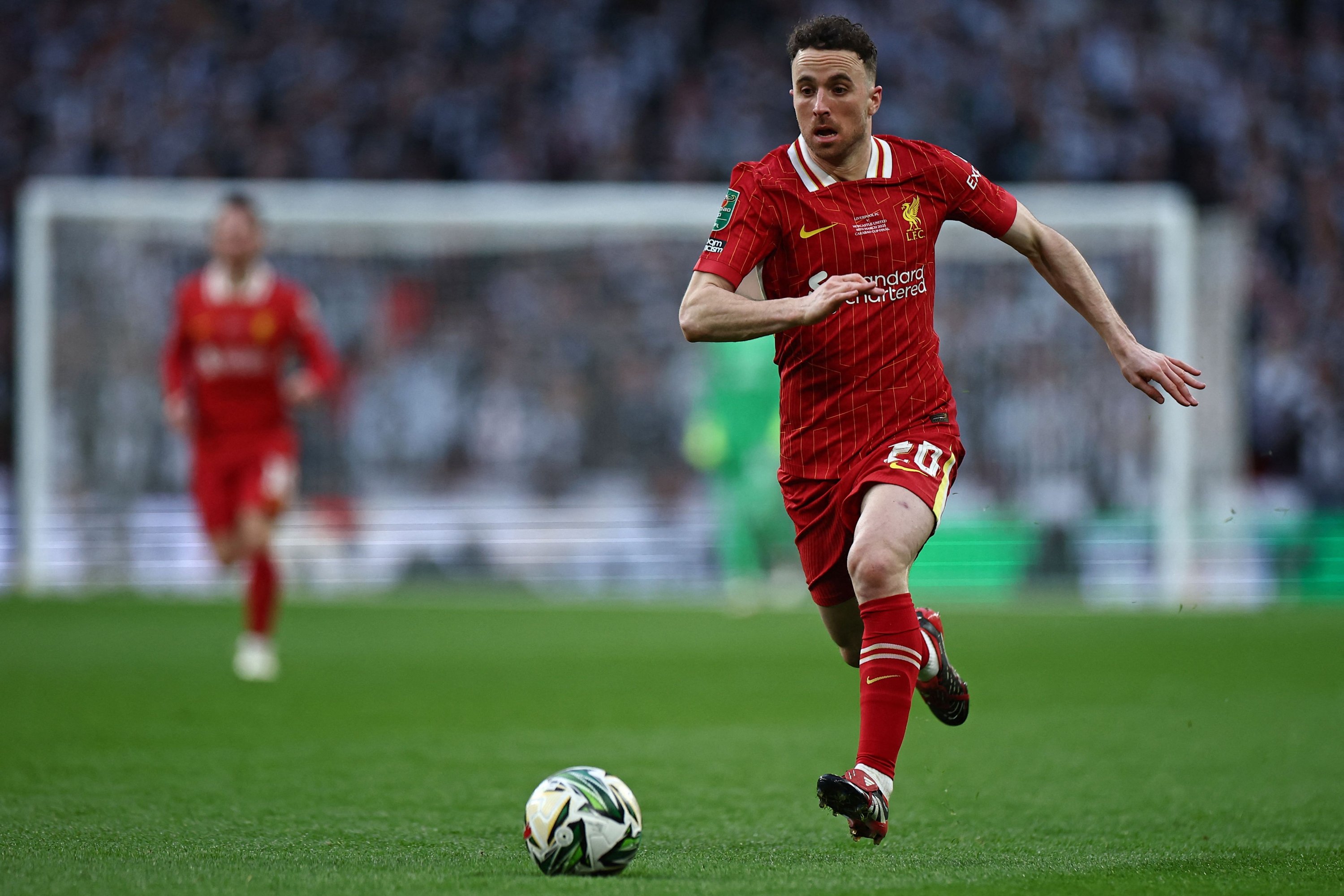Liverpool's Diogo Jota runs with the ball during the English League Cup final football match between Liverpool and Newcastle United at Wembley Stadium, London, U.K., March 16, 2025. (AFP Photo)