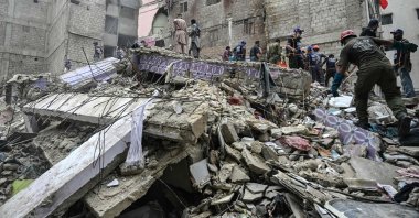 A rescue operation is underway at the site where a residential building collapsed, Karachi, Pakistan, July 4, 2025. (AFP Photo)