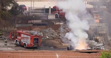 Firefighters monitor the area where a gas station exploded on the outskirts of Rome, Friday, July 4, 2025. (Cecilia Fabiano/LaPresse via AP)