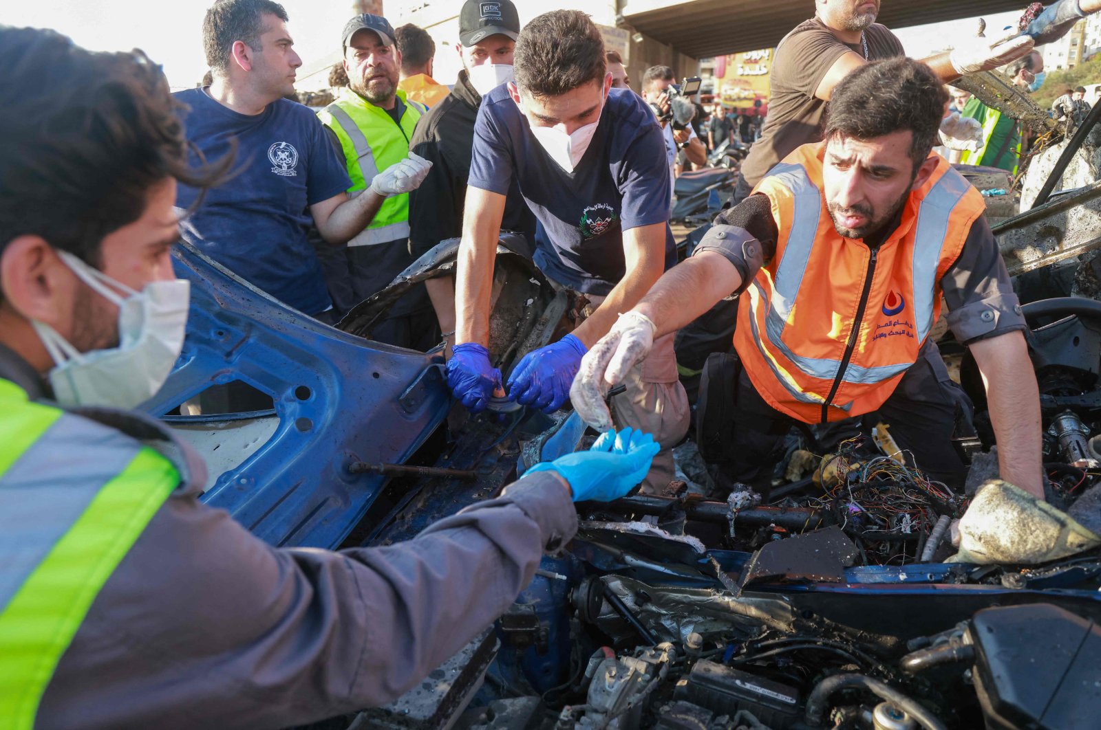 Lebanese emergency responders inspect the debris at the site of a reported Israeli strike on a vehicle in Khaldeh, Beirut, Lebanon, July 3, 2025. (AFP Photo)