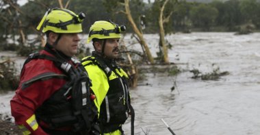 Kerrville Fire Department first responders scan the banks of the Guadalupe River for individuals swept away by flooding in Ingram, Texas, July 4, 2025. (AP Photo)
