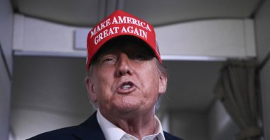 President Donald Trump speaks to journalists aboard Air Force One after departing Joint Base Andrews, Maryland on his way to Bedminster, New Jersey, U.S., July 4, 2025. (AFP Photo)