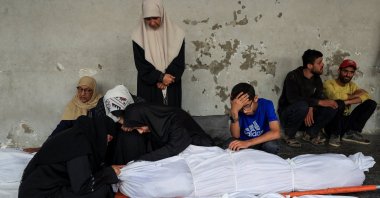 Mourners react next to bodies at the funeral of Palestinians killed in an overnight Israeli air strike on an UNRWA school sheltering displaced people, according to Gaza’s health ministry, at Al-Ahli Arab Hospital in Gaza City, July 5, 2025. (Reuters Photo)