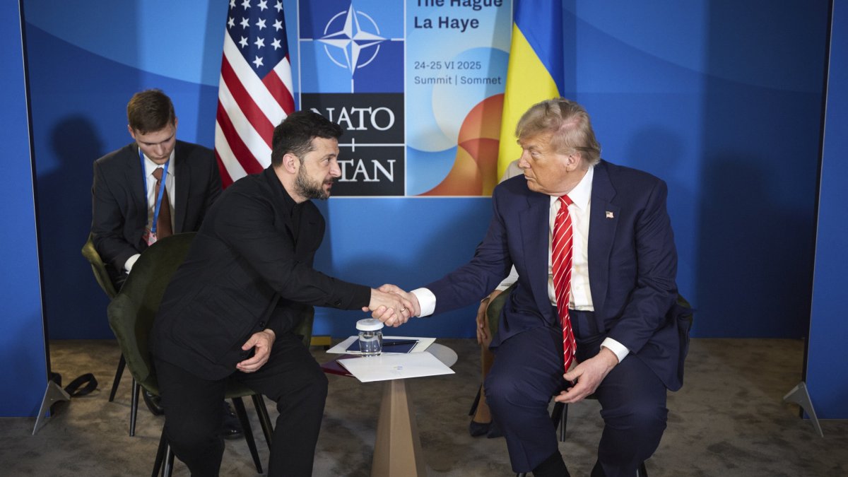 A handout photo made available by the Presidential Press Service of Ukraine shows Ukrainian President Volodymyr Zelenskyy (L) and U.S. President Donald Trump shaking hands during a meeting on the sidelines of the NATO summit, The Hague, Netherlands, June 25, 2025. (EPA Photo)