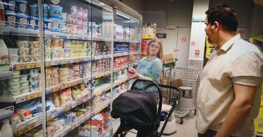 Maria Tyabut and her husband Sergei Duzhikov choose food at a shop in the Moscow suburb of Mytishchi, Russia, June 17, 2025. (AFP Photo)