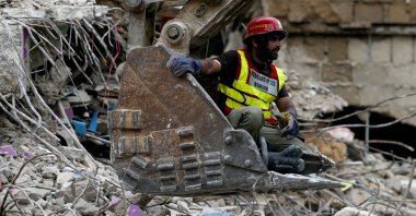 A rescue worker is pictured during a search operation amid the debris of a collapsed building in Karachi, Pakistan, July 5, 2025. (AFP Photo)