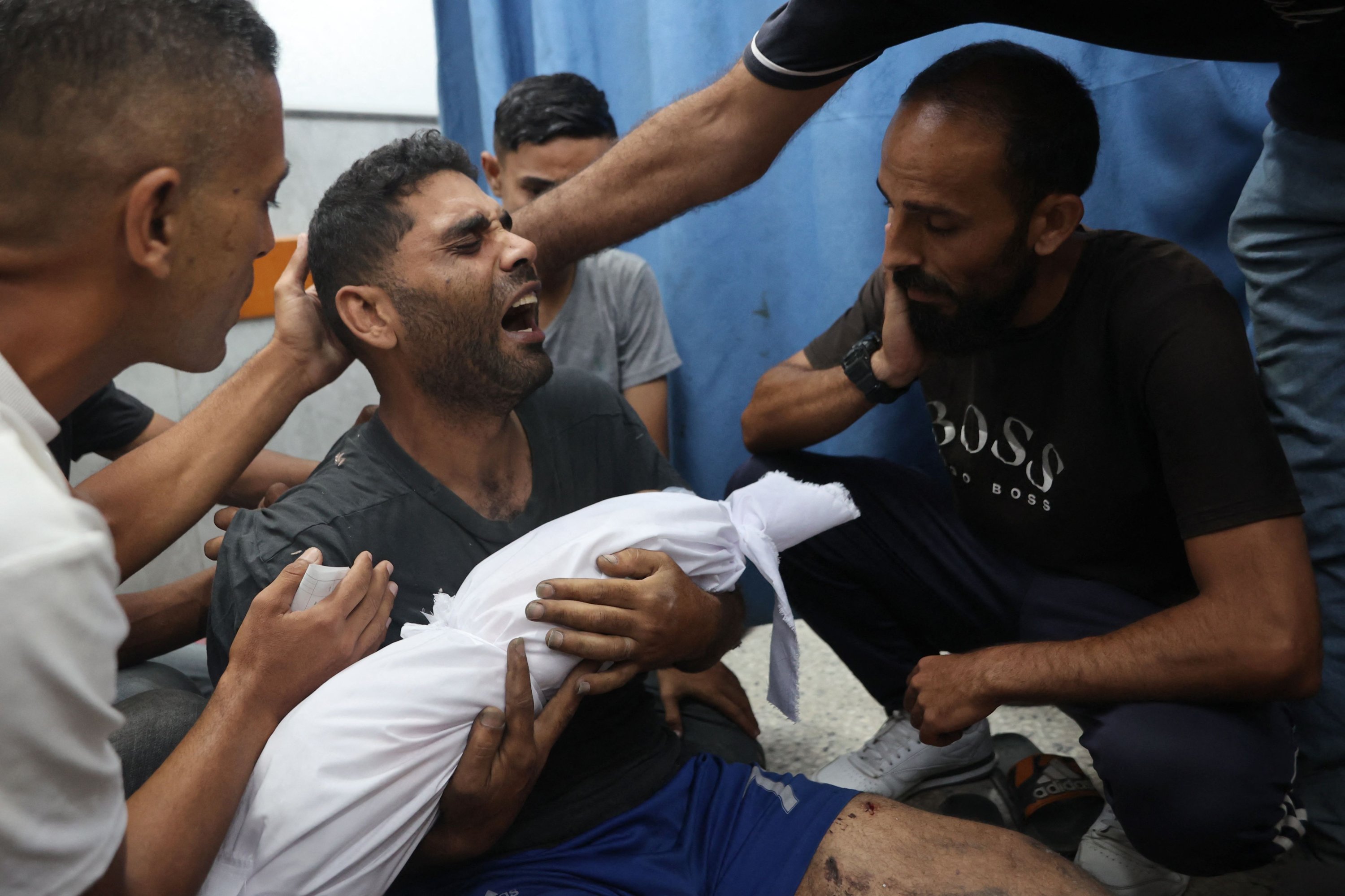 Ahmad mourns as he carries the shrouded body of his 6-month-old son Yahya Sayyam, who was killed in an Israeli strike, Gaza City, central Gaza, July 7, 2025. (AFP Photo)