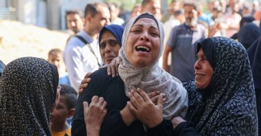 A Palestinian woman mourns a relative, killed in an Israeli strike, outside the al-Shifa hospital in Gaza City, central Gaza, July 7, 2025. (AFP Photo)